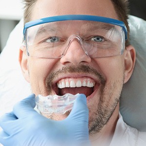 A man getting a nightguard from his dentist