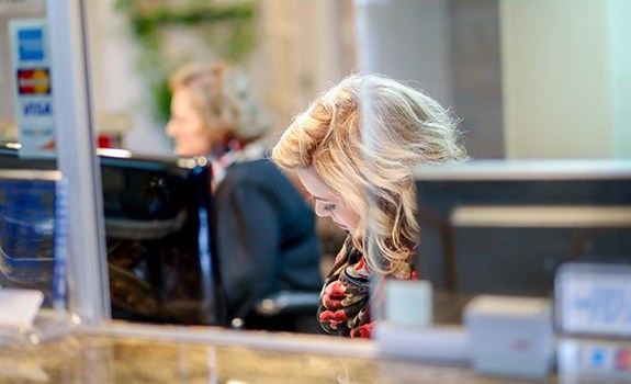 Dental team member at reception desk