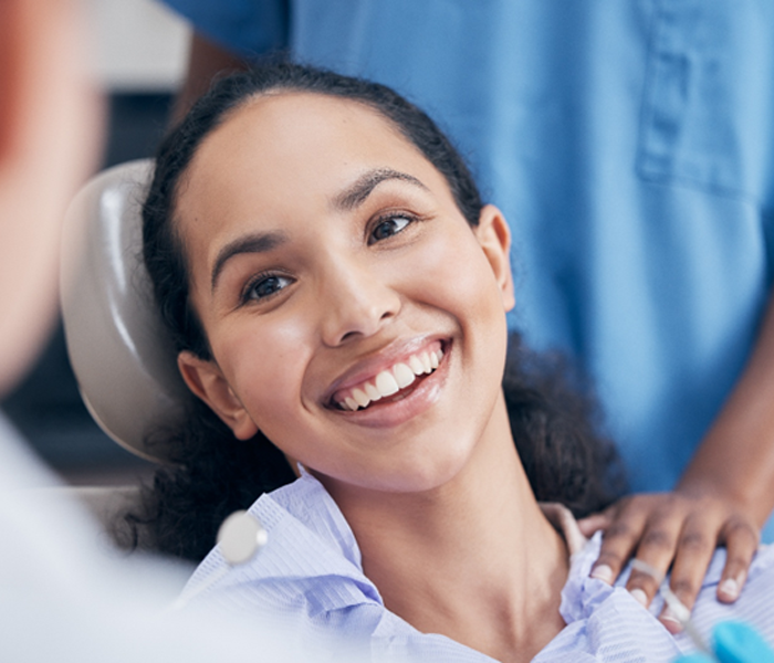 Young woman smiling after dental hygiene