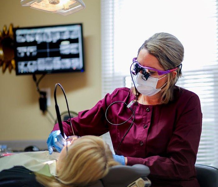 Team member treating dental patient