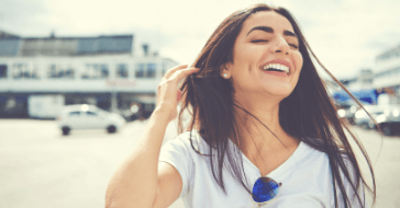 Woman with gorgeous smile after cosmetic dentistry