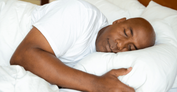 Man sleeping soundly after oral appliance therapy for sleep apnea