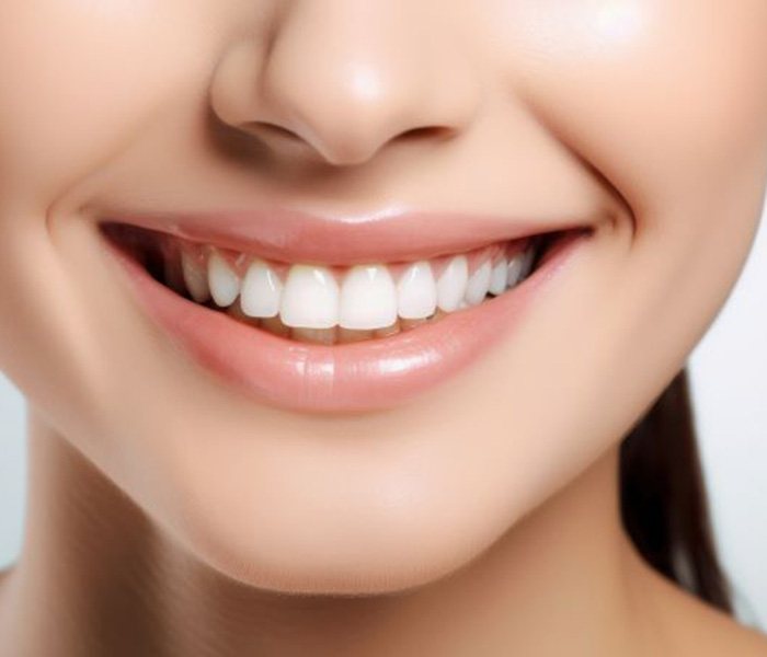 Close-up of woman’s beautiful smile with an E4D crown