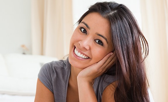 Young woman with healthy smile after periodontal treatment