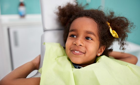 Young girl smiling during children's dentistry visit