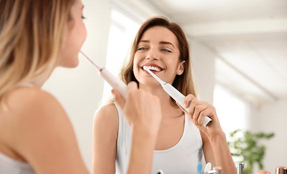 Woman brushing her teeth