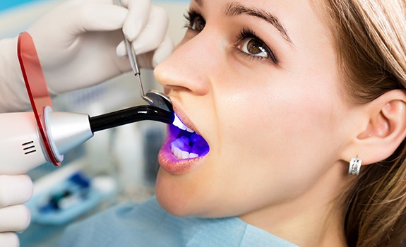 Patient receiving dental bonding treatment