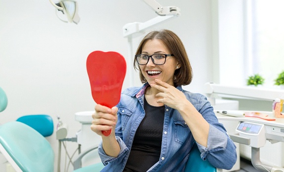 Woman after dental implant dentist in Rowley