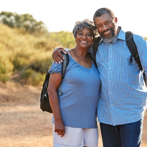 Couple smiling with dental implants in Rowley