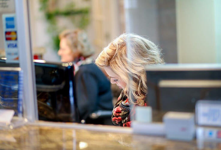 Dental team member at reception desk