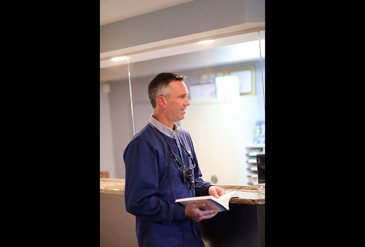 Doctor Saint Clair at reception desk