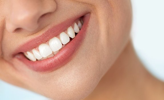 Closeup of woman sharing bright smile after teeth whitening