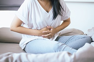 Pregnant woman holding her stomach