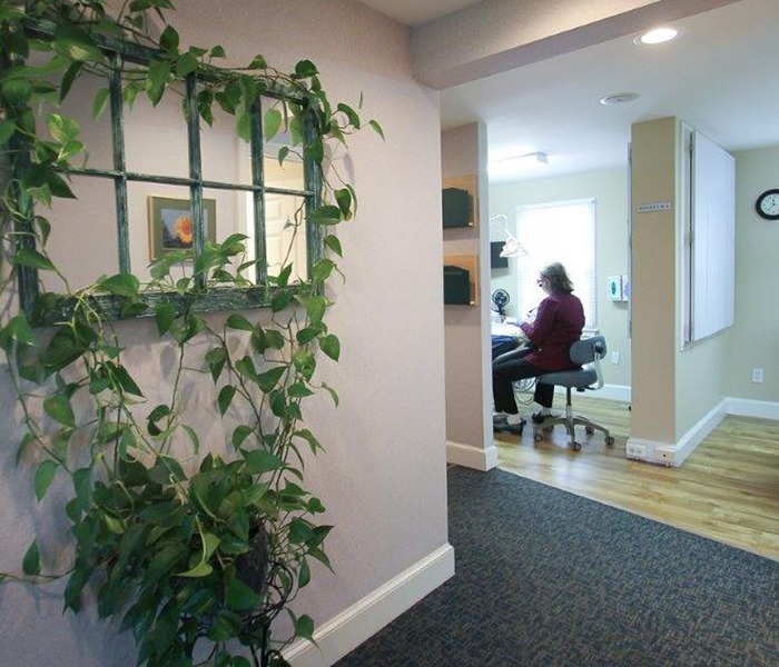 Dental team member providing gum disease treatment