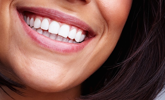 Closeup of healthy smile after gum disease treatment