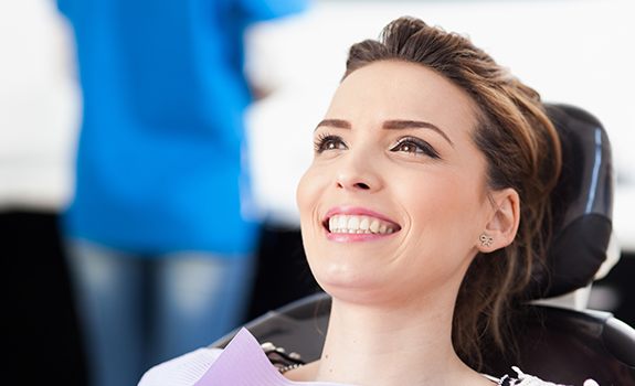 Comfortable patient smiling at dentist