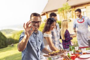 Happy man at barbeque