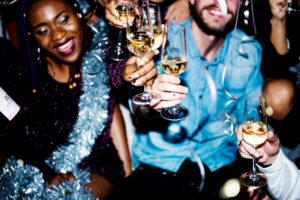 Friends smiling and toasting champagne at a New Year's party